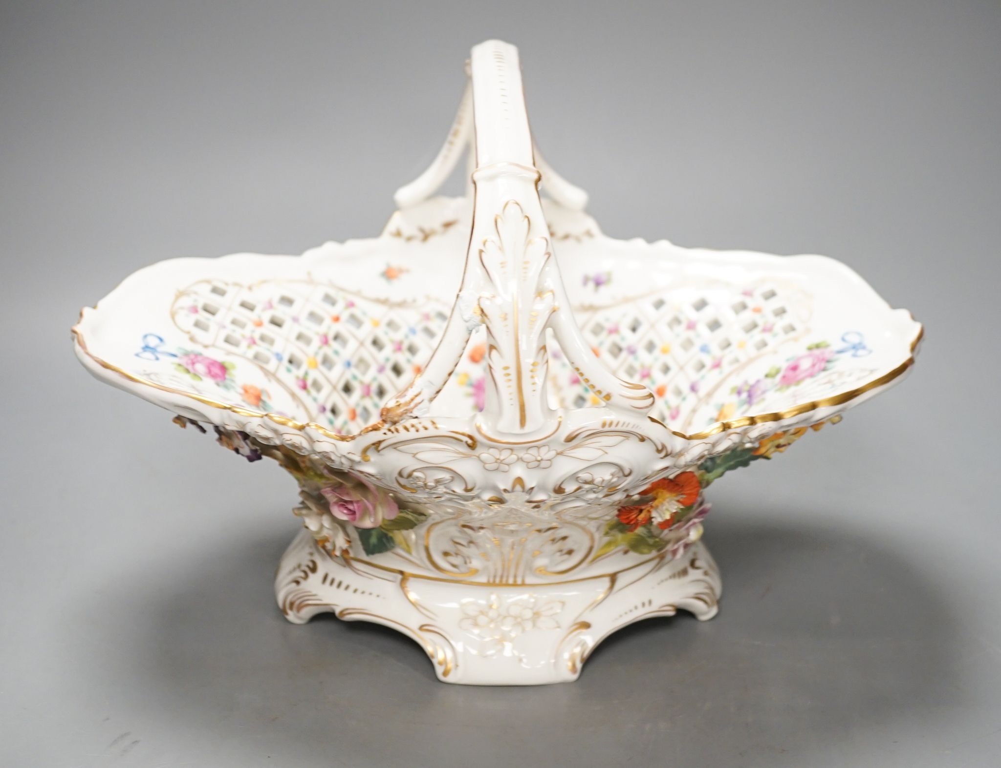 A Dresden porcelain floral encrusted basket 34cm